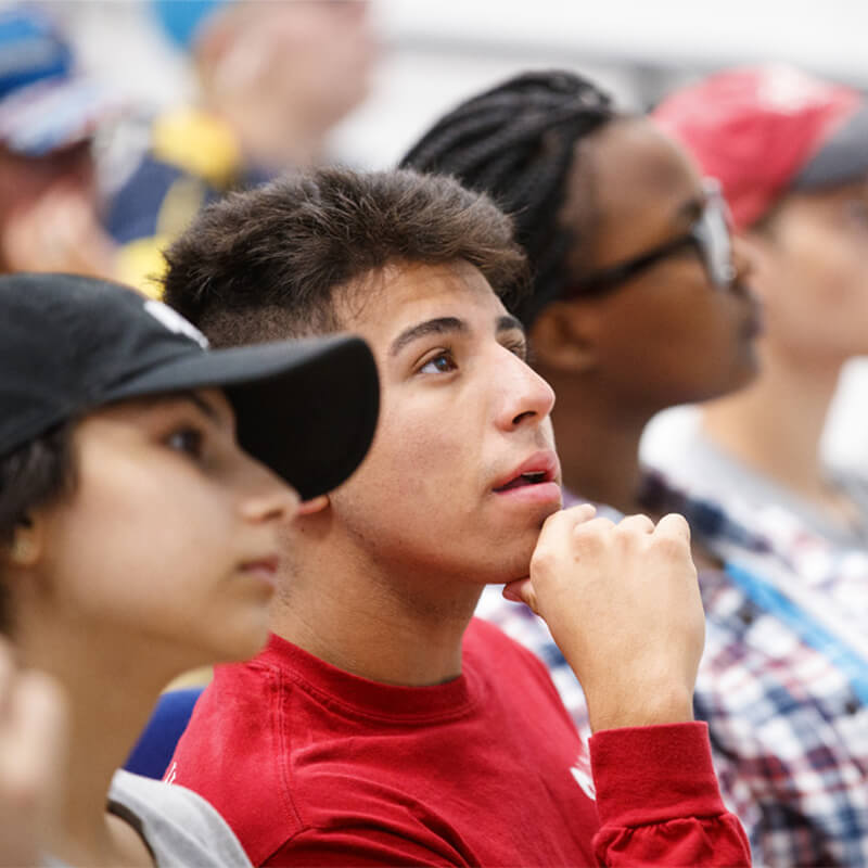 Students in lecture hall listening to faculty member